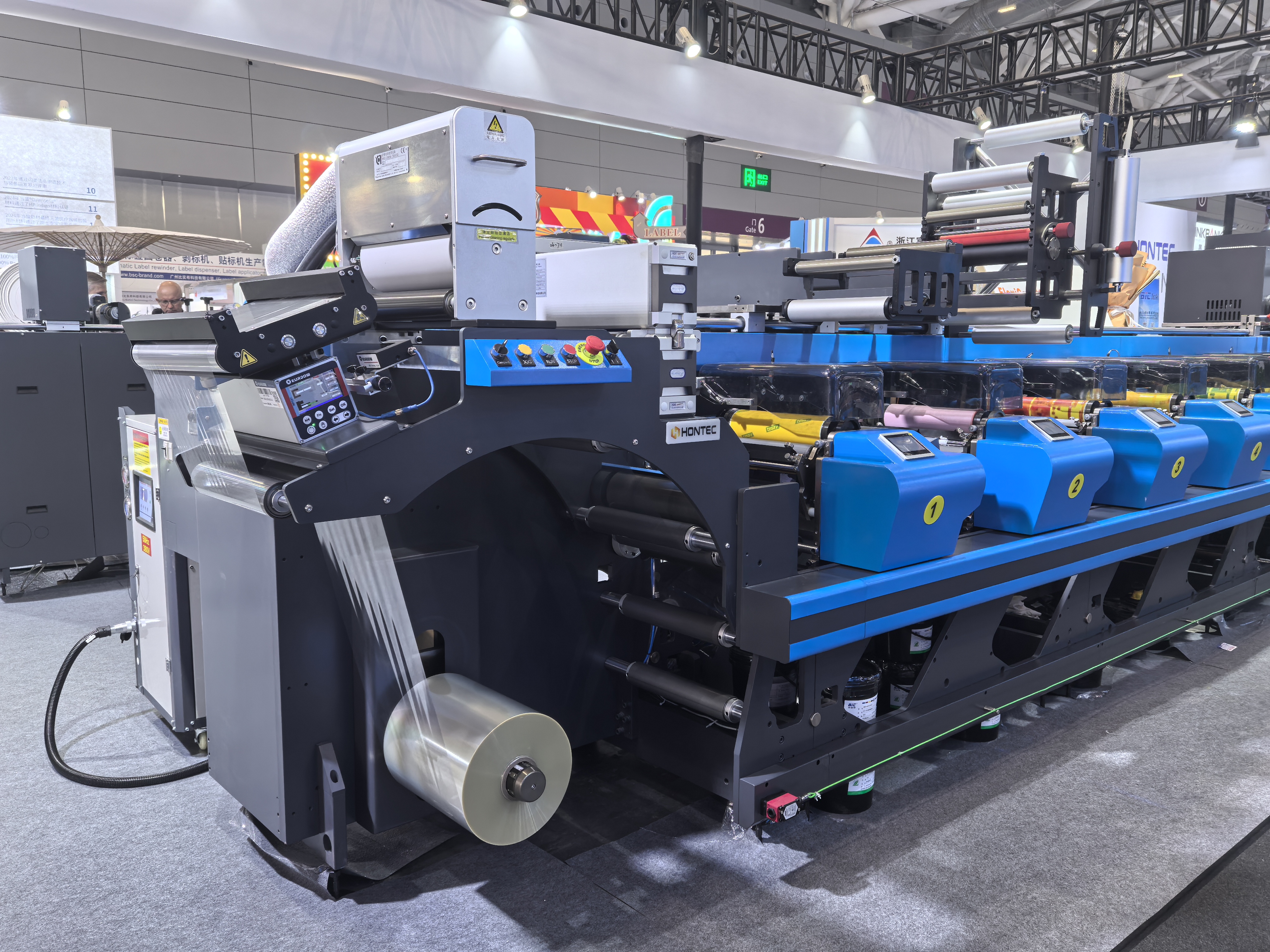 Narrow web label printing machine with integrated web guiding system